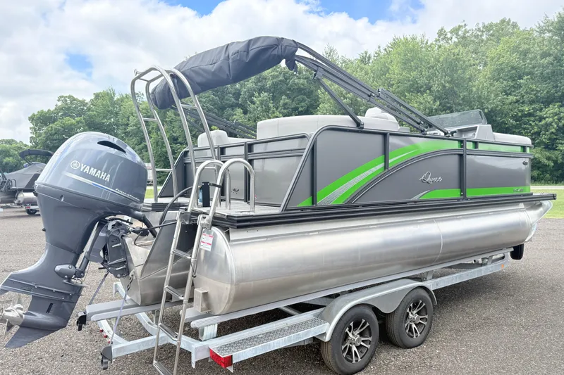 Slide: The Image of 2026 Qwest E-Class RLS 18 pontoon boat with Yamaha motor on trailer. - 3