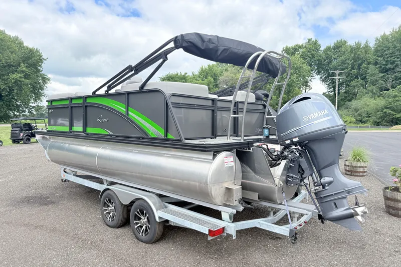 Slide: The Image of 2026 Qwest E-Class RLS 18 pontoon boat with Yamaha motor on trailer. - 4