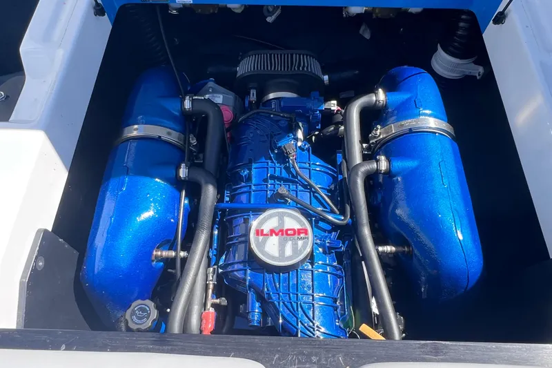 Slide: The Image of 2021 MasterCraft XT23 engine with blue Ilmor components, showcasing powerful marine performance. - 19