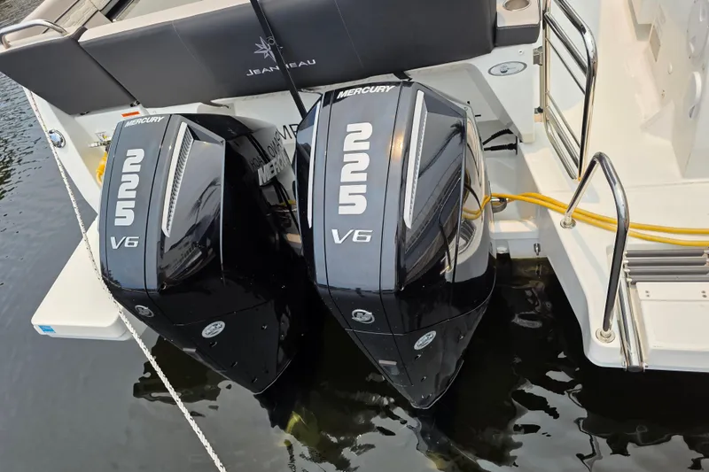 Slide: The Image of Twin Mercury 225 V6 engines on a 2025 Jeanneau NC 895 Series 2 boat. - 13
