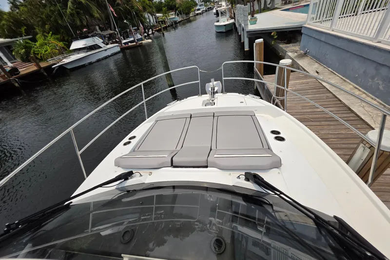 Slide: The Image of 2025 Jeanneau NC 895 Series 2 boat docked, featuring spacious deck and sleek design. - 18