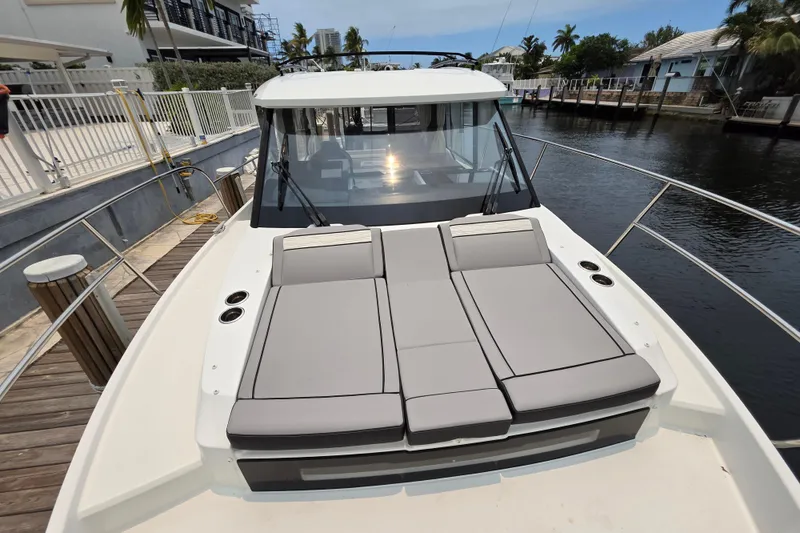 Slide: The Image of 2025 Jeanneau NC 895 Series 2 boat with spacious deck and comfortable seating. - 19