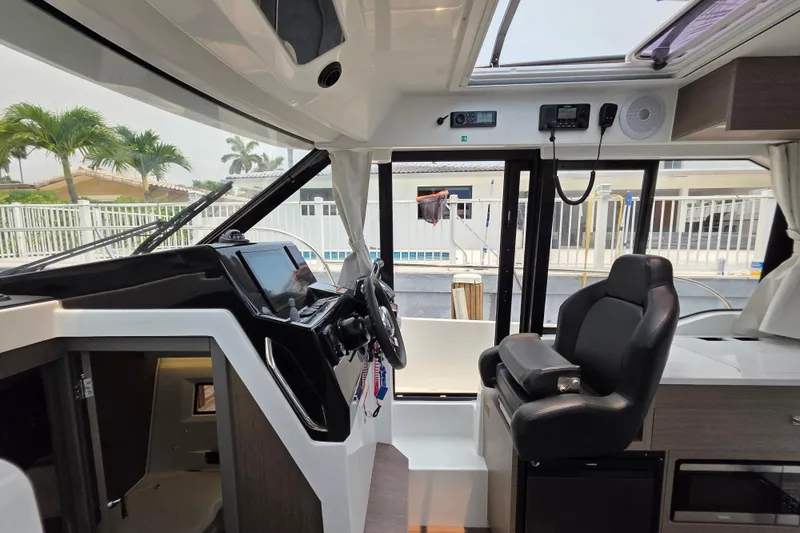 Slide: The Image of Interior of 2025 Jeanneau NC 895 Series 2 boat with modern helm and seating. - 26