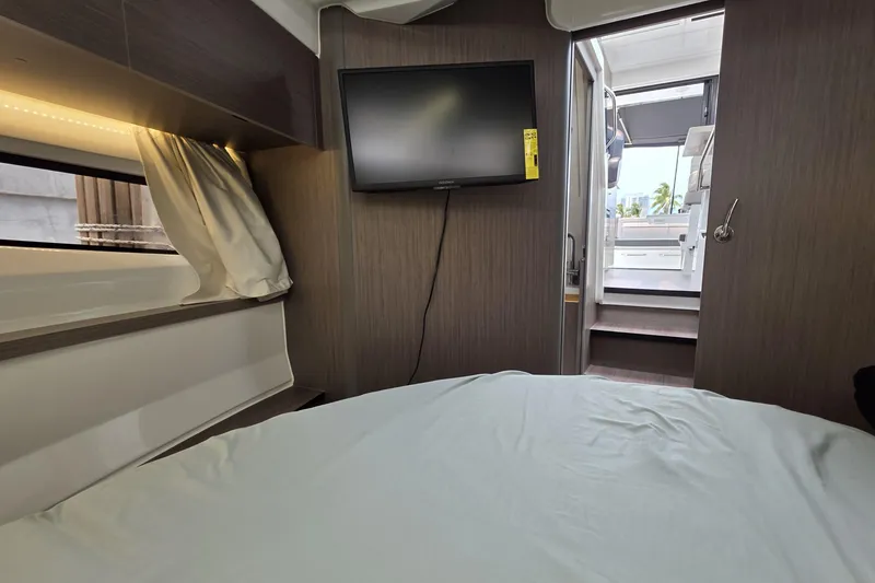 Slide: The Image of Interior cabin view of 2025 Jeanneau NC 895 Series 2 with TV and bed. - 33