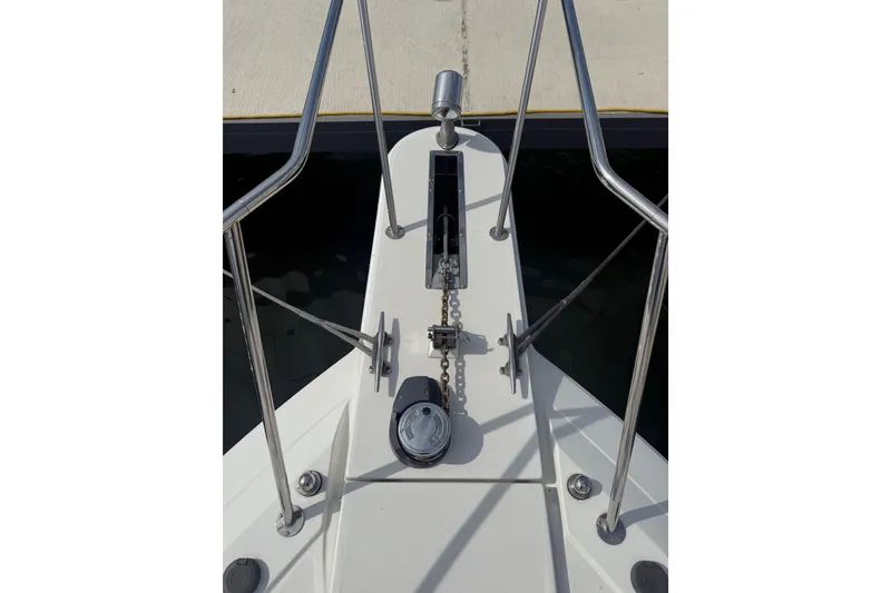 Slide: The Image of Bow of 1999 Formula 34 Performance Cruiser with anchor chain and railing. - 10
