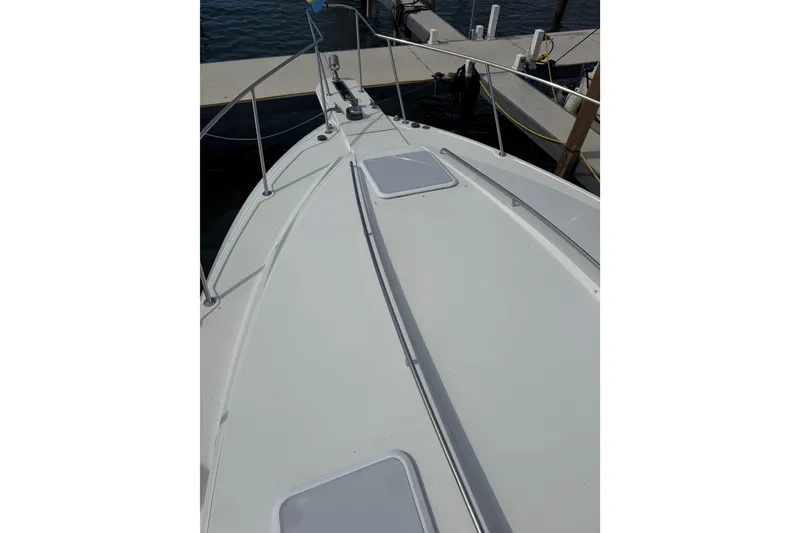 Slide: The Image of 1999 Formula 34 Performance Cruiser docked, showing sleek deck design and marina setting. - 11