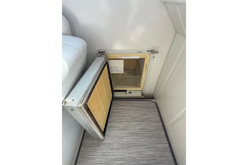Slide: The Image of Open hatch on 1999 Formula 34 Performance Cruiser, revealing interior compartment. - 16
