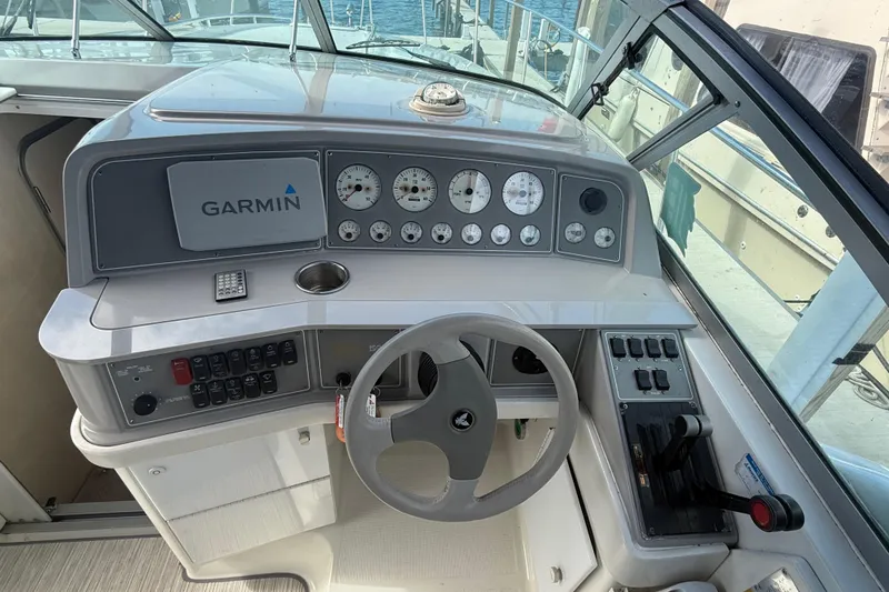 Slide: The Image of 1999 Formula 34 Performance Cruiser helm with Garmin navigation and control panel. - 18