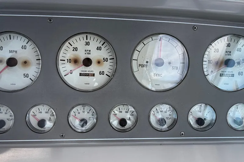 Slide: The Image of Dashboard of a 1999 Formula 34 Performance Cruiser with various gauges and dials. - 20