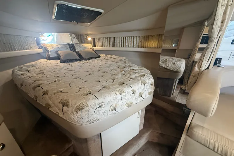Slide: The Image of 1999 Formula 34 Performance Cruiser cabin with cozy bed and elegant decor. - 33