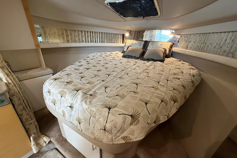 Slide: The Image of 1999 Formula 34 Performance Cruiser cabin with cozy bed and elegant decor. - 34