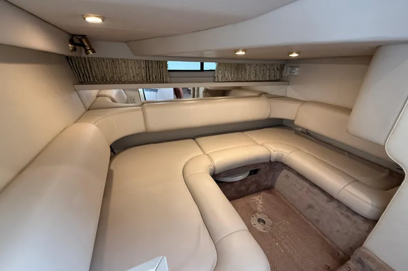Slide: The Image of Interior of a 1999 Formula 34 Performance Cruiser with beige seating and ambient lighting. - 37