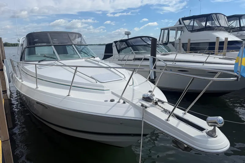 Slide: The Image of 1999 Formula 34 Performance Cruiser docked, showcasing sleek design and spacious deck. - 5