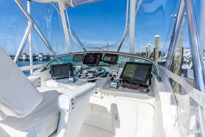 Slide: The Image of Interior view of a 1979 Bertram Flybridge Cruiser with modern electronics. - 38