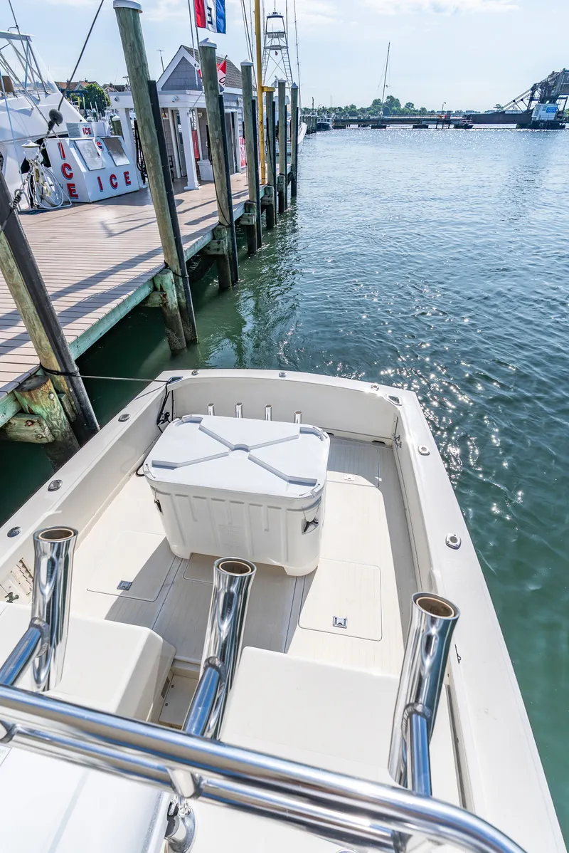 Slide: The Image of 1979 Bertram Flybridge Cruiser docked with a view of the water. - 42