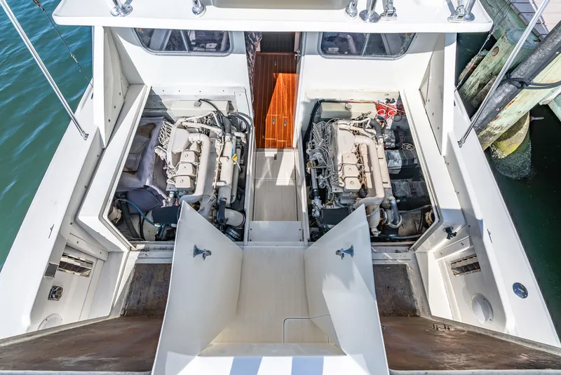 Slide: The Image of Engine compartment of a 1979 Bertram Flybridge Cruiser with two engines. - 48