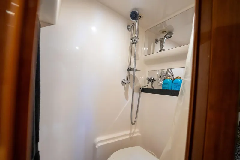 Slide: The Image of Luxurious bathroom in 2008 Regal Commodore 4460 yacht with shower and toiletries. - 42