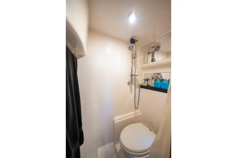 Slide: The Image of Compact bathroom in 2008 Regal Commodore 4460 yacht with shower and toilet. - 44