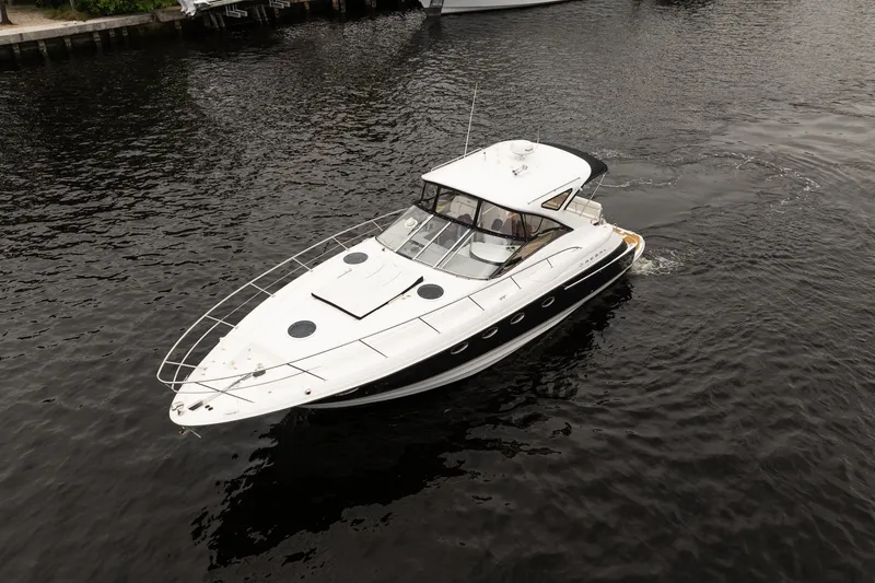 Slide: The Image of 2008 Regal Commodore 4460 yacht cruising on calm waters. - 13