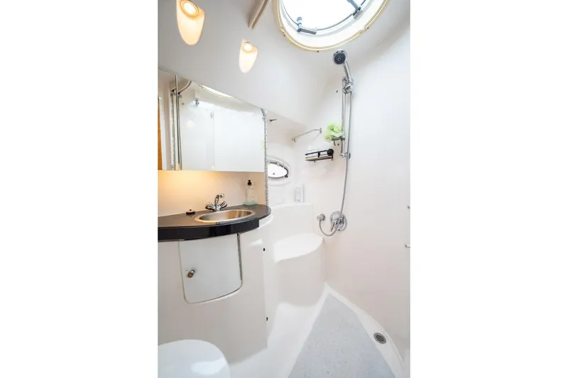 Slide: The Image of Luxurious bathroom in 2008 Regal Commodore 4460 yacht with modern fixtures and shower. - 40
