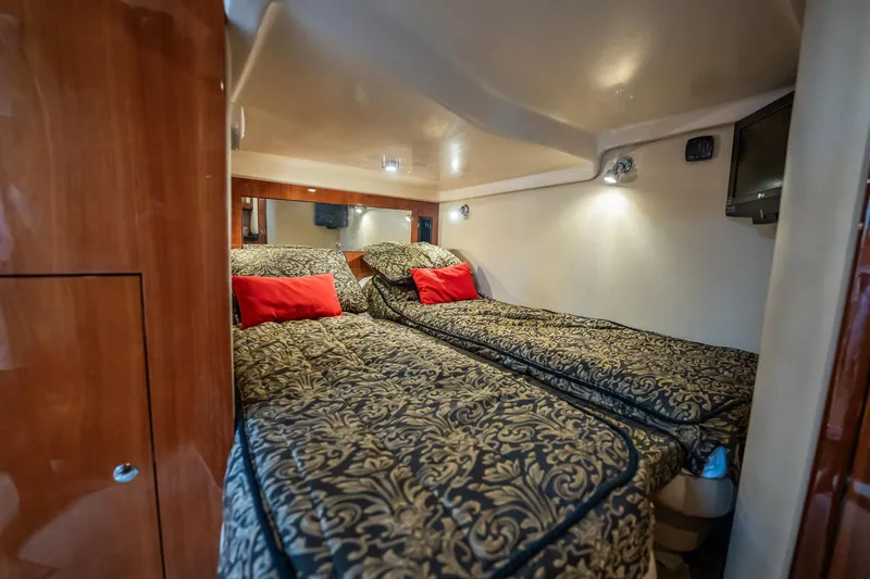 Slide: The Image of Luxurious 2008 Regal Commodore 4460 cabin with twin beds and elegant decor. - 50