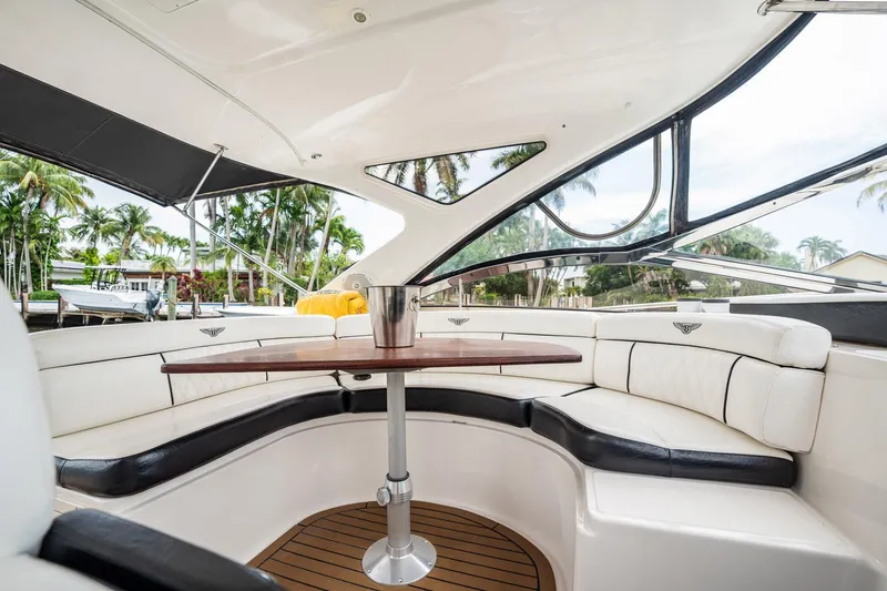 Slide: The Image of Luxurious interior of 2008 Regal Commodore 4460 yacht with elegant seating and table. - 74