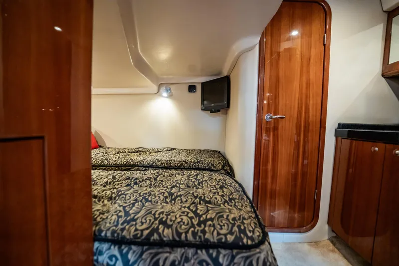 Slide: The Image of Luxurious cabin interior of 2008 Regal Commodore 4460 yacht with twin beds. - 53