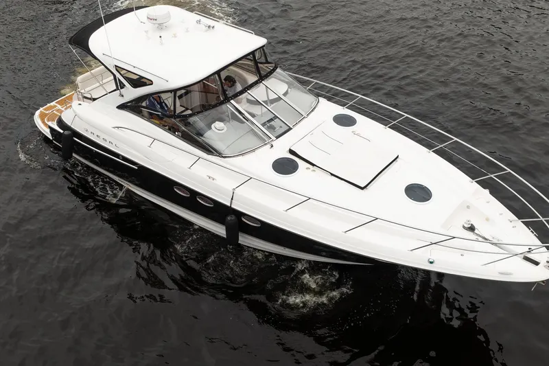 Slide: The Image of 2008 Regal Commodore 4460 yacht cruising on open water, top view. - 3