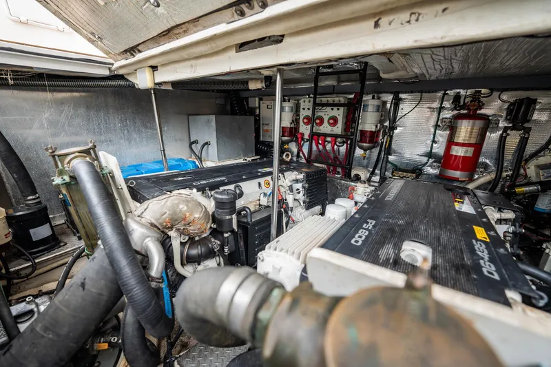 Slide: The Image of Engine room of a 2008 Regal Commodore 4460 yacht, showcasing mechanical components. - 46