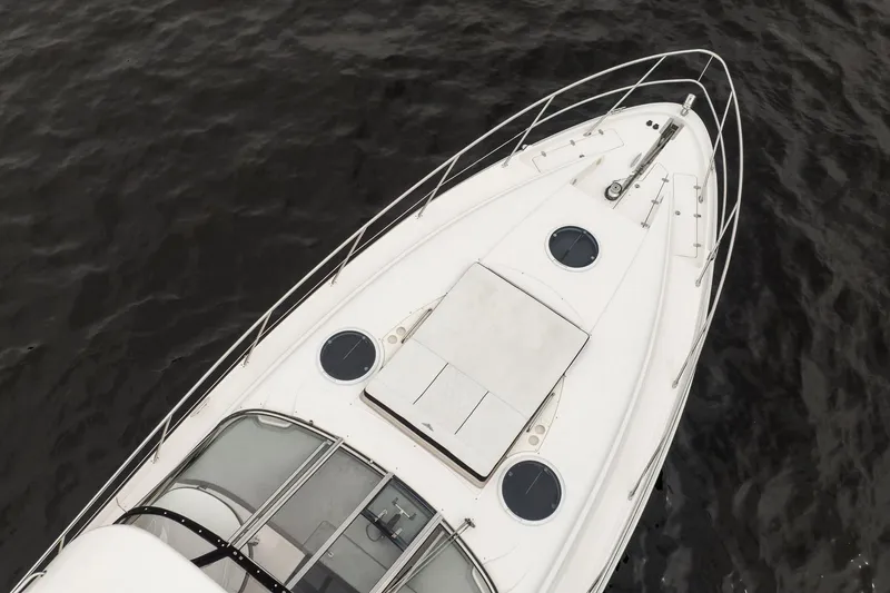 Slide: The Image of Top view of 2008 Regal Commodore 4460 yacht on dark water. - 2