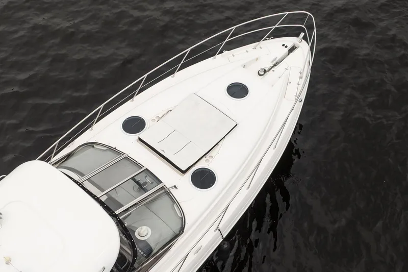 The Image of 2008 Regal Commodore 4460 yacht on dark water, aerial view. - 2
