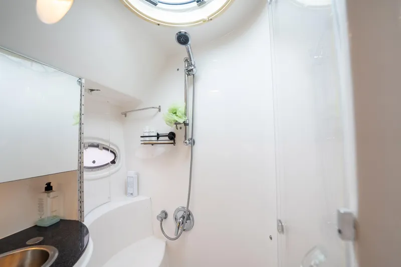 Slide: The Image of Bathroom interior of 2008 Regal Commodore 4460 yacht, featuring shower and sink. - 39