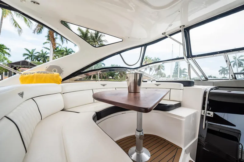 Slide: The Image of Luxurious interior of 2008 Regal Commodore 4460 yacht with elegant seating and table. - 83