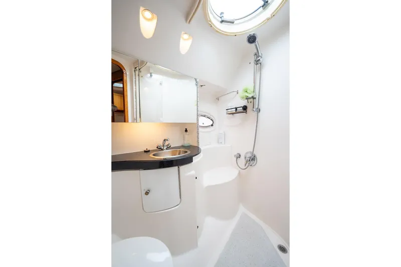 Slide: The Image of Luxurious bathroom in 2008 Regal Commodore 4460 yacht with modern fixtures and lighting. - 41