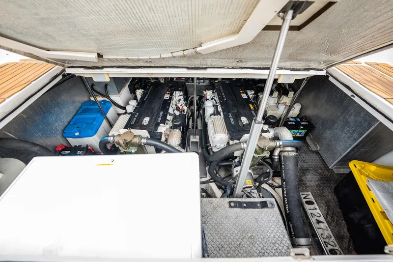 Slide: The Image of Engine compartment of a 2008 Regal Commodore 4460 boat, showcasing dual engines and components. - 45