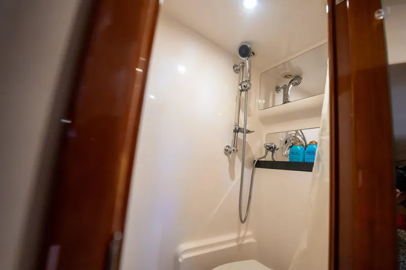 Slide: The Image of Luxurious bathroom in 2008 Regal Commodore 4460 yacht with shower and toiletries. - 43