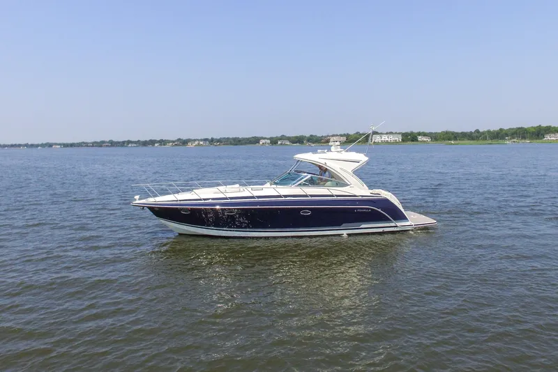 Slide: The Image of 2016 Formula 40 Performance Cruiser on calm water, clear sky background. - 9