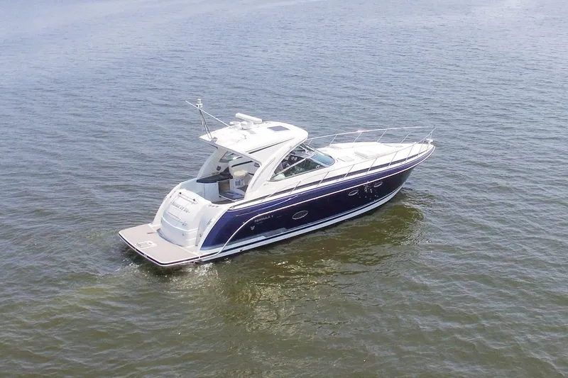 Slide: The Image of 2016 Formula 40 Performance Cruiser on calm water, showcasing sleek design and luxury features. - 5