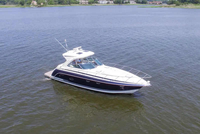 Slide: The Image of 2016 Formula 40 Performance Cruiser on calm water, showcasing sleek design and luxury features. - 1