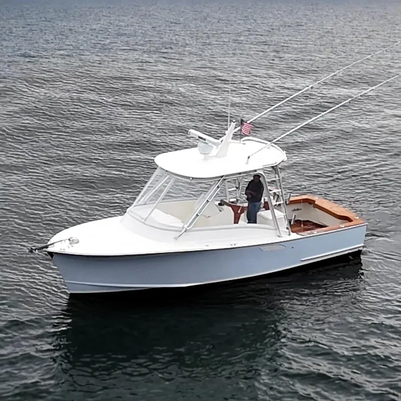 The Image of 1996 Tides 27 on calm water. - 0