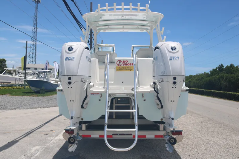 Slide: The Image of 2026 World Cat 280 DC-X boat with twin Yamaha 200 engines, rear view. - 4