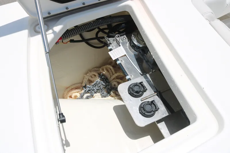 Slide: The Image of Anchor storage compartment on 2026 World Cat 280 DC-X boat, featuring ropes and chains. - 7