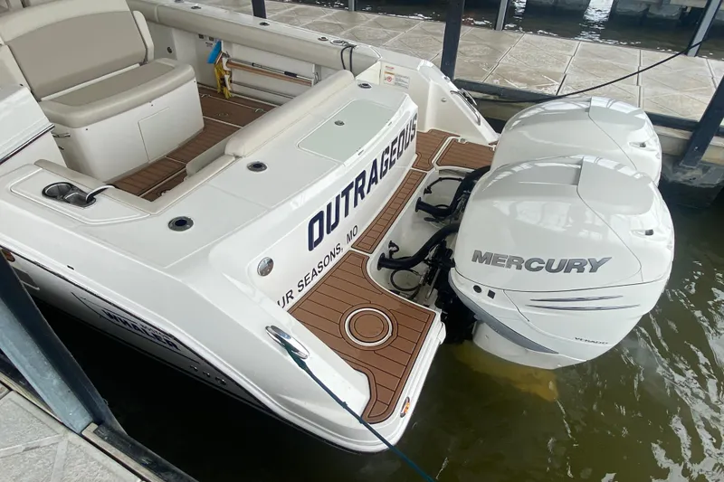 Slide: The Image of 2016 Boston Whaler 330 Outrage with twin Mercury engines docked at marina. - 13