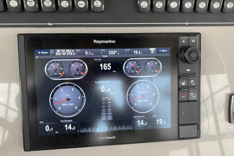 Slide: The Image of Raymarine display on 2016 Boston Whaler 330 Outrage showing navigation and engine data. - 18