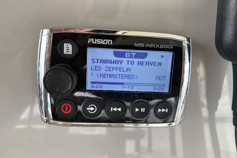 Slide: The Image of Fusion MS-NRX200i stereo displaying "Stairway to Heaven" by Led Zeppelin on a 2016 Boston Whaler 330 Outrage. - 20