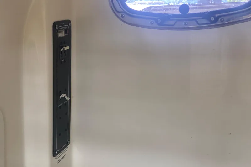 Slide: The Image of Interior view of 2016 Boston Whaler 330 Outrage boat with control panel and window. - 37