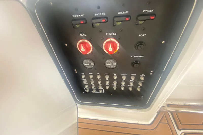 Slide: The Image of Control panel of a 2016 Boston Whaler 330 Outrage boat with switches and dials. - 42