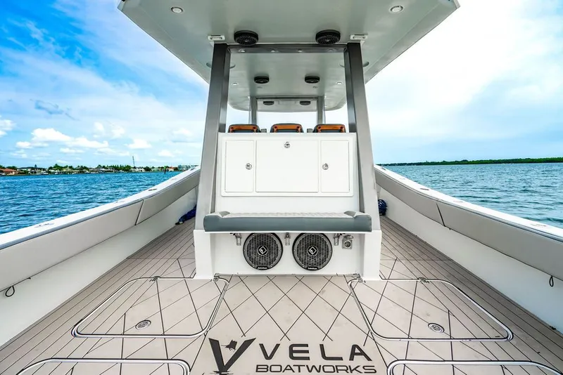 Slide: The Image of Custom 368 Center Console 2021 on the water with spacious deck and seating area. - 14