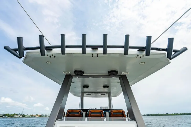 Slide: The Image of View of a Custom 368 Center Console boat roof with fishing rod holders. - 17