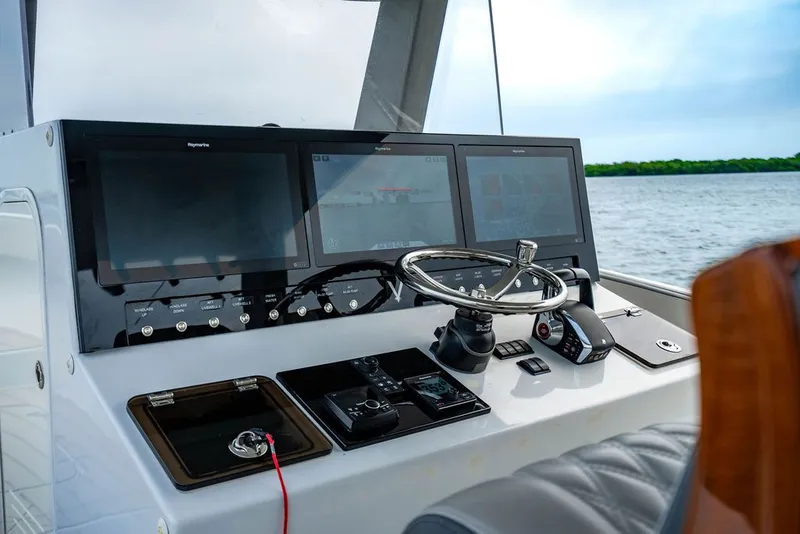 Slide: The Image of Helm of a 2021 Custom 368 Center Console boat. - 19